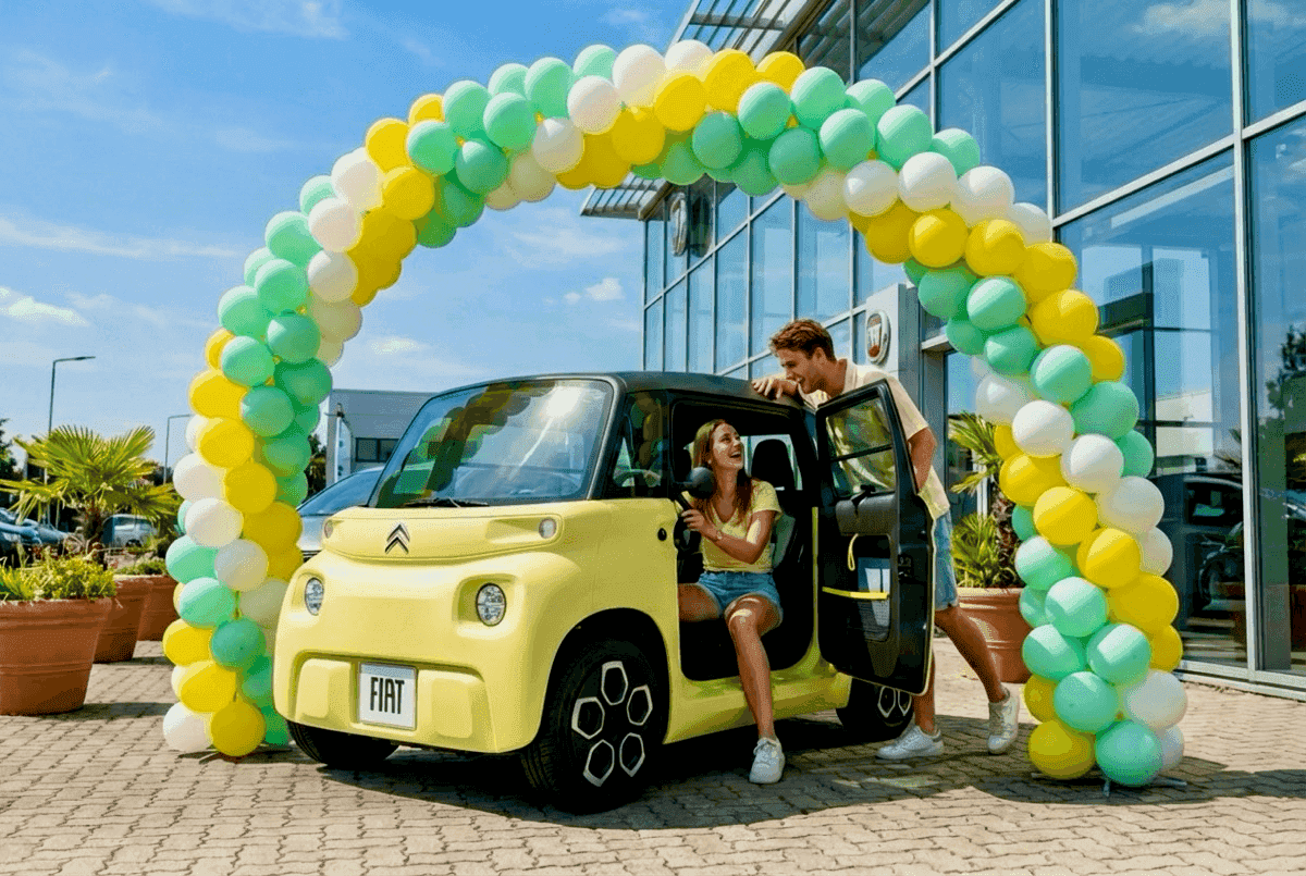 PilaMania balloon arch with small electric city car in sunny outdoor setting