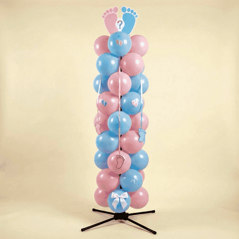 Classic gender reveal balloon pillar with alternating pink and blue balloons and cute baby footprints decorations
