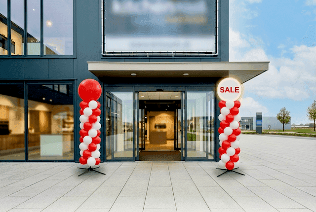 The same shop entrance with sleek, professional PilaMania balloon columns that still look perfect after weeks