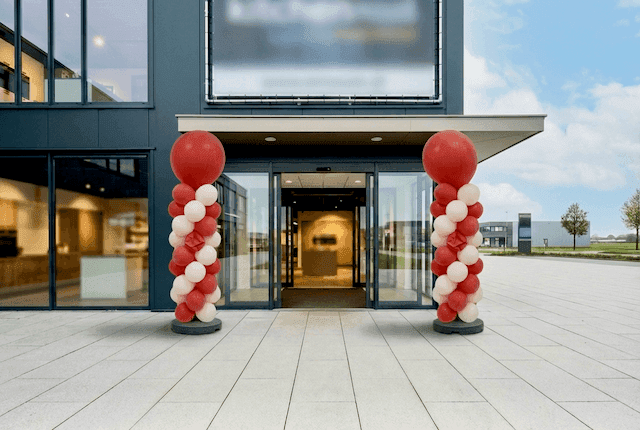 Shop entrance with wilted, deflated traditional balloon columns after just one day of use