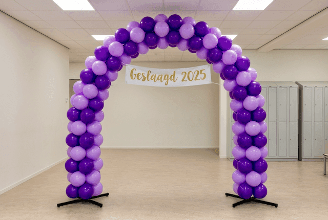 Balloon arch in school colours as photo wall at graduation ceremony, ideal for social media