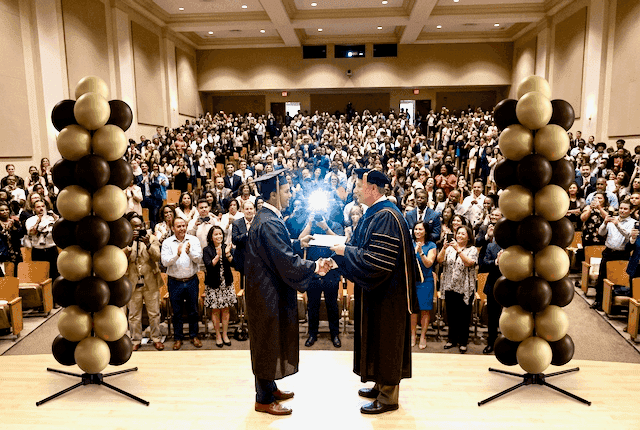 Elegant balloon columns in neutral colours at a university graduation ceremony