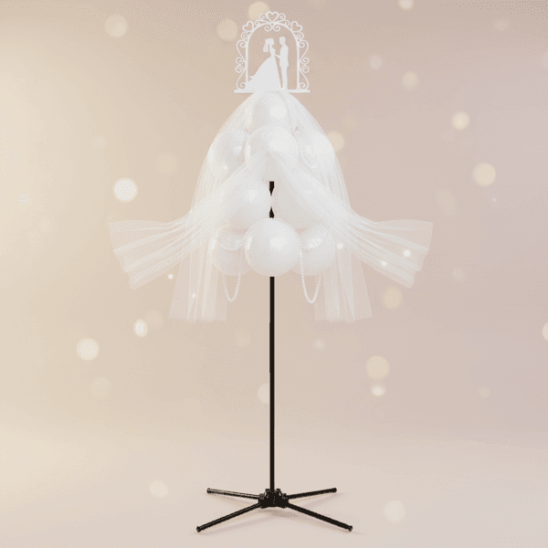 Balloon fountain decorated with tulle, pearls, and an elegant topper